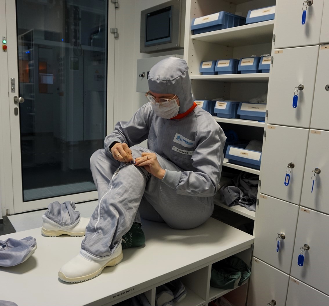 Rebecca locks her cleanroom garments in the personnel airlock.