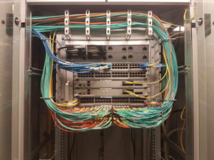 A big switch with many colorful network cables