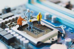 Computer motherboard with construction worker figures