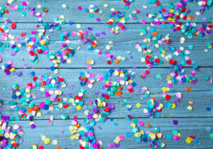 Colorful confetti on wooden floor