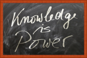 Board with "Knowledge is Power" written on it