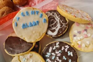 Colorful baked goods with icing and IT Center Alaaf topping