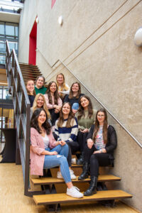Editorial team, group photo on the stairs in the foyer