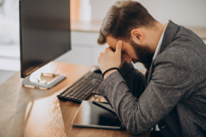 Frustrated man at his workplace