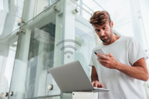 A man trying to connect his devices to the Internet.