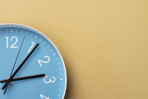 Blue clock on an orange background