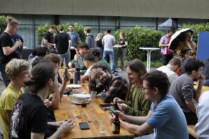 Trainees playing cards at the Barbecue