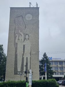 A statue featuring sketches of people.